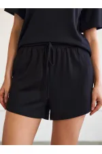 010882 Short mini en maille à taille élastique