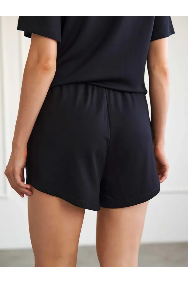 010882 Short mini en maille à taille élastique