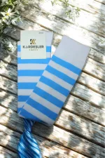 White knee-high cotton socks with blue stripes