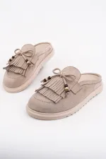 Mocassins Muggo FRINGE en daim, bout fermé, à pampilles et nœud décoratif.