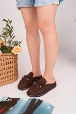 Mocassins Muggo FRINGE en daim, bout fermé, à pampilles et nœud décoratif.