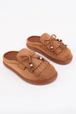 Mocassins Muggo FRINGE en daim, bout fermé, à pampilles et nœud décoratif.