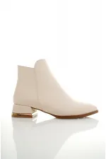 Bottes Muggo SHANE pour femmes, garanties, avec détail métallique au talon et fermeture éclair.