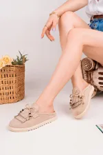 Mocassins Muggo FRINGE en daim, bout fermé, à pampilles et nœud décoratif.