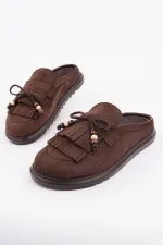 Mocassins Muggo FRINGE en daim, bout fermé, à pampilles et nœud décoratif.