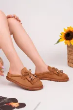 Mocassins Muggo FRINGE en daim, bout fermé, à pampilles et nœud décoratif.