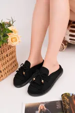 Mocassins Muggo FRINGE en daim, bout fermé, à pampilles et nœud décoratif.