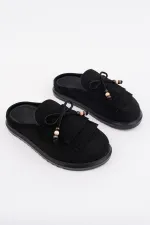 Mocassins Muggo FRINGE en cuir suédé pour femmes, bout fermé, ornés d'un nœud et de pompons, style confortable au quotidien.
