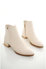 Bottes Muggo SHANE pour femmes, garanties, avec détail métallique au talon et fermeture éclair.