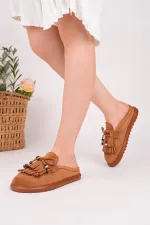 Mocassins Muggo FRINGE en daim, bout fermé, à pampilles et nœud décoratif.