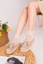 Mocassins Muggo FRINGE en daim, bout fermé, à pampilles et nœud décoratif.