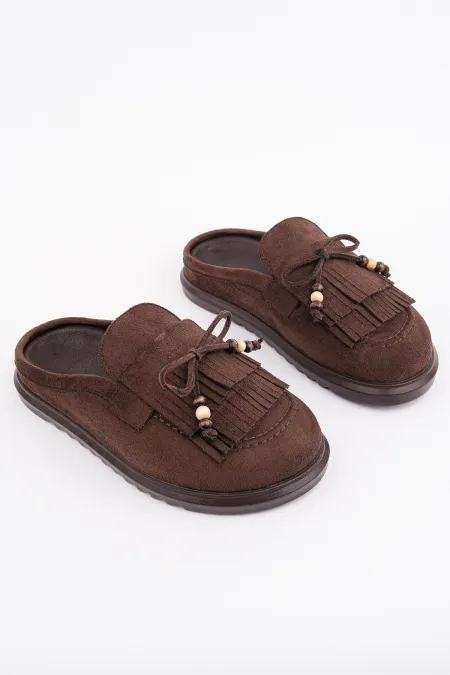 Mocassins Muggo FRINGE en daim, bout fermé, à pampilles et nœud décoratif.