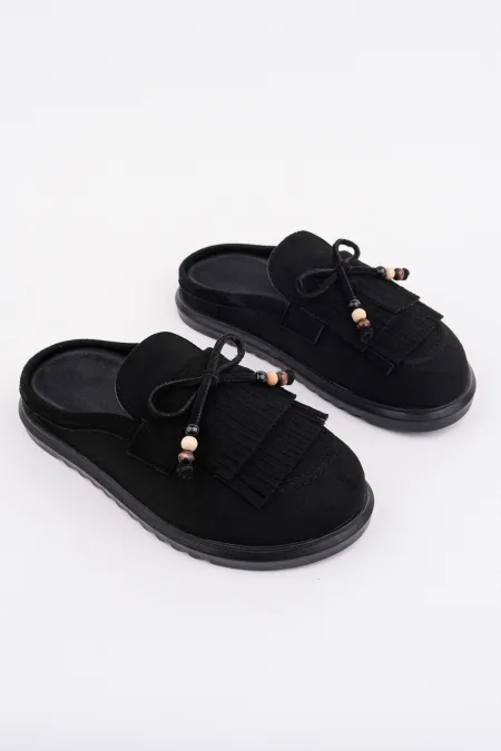 Mocassins Muggo FRINGE en cuir suédé pour femmes, bout fermé, ornés d'un nœud et de pompons, style confortable au quotidien.