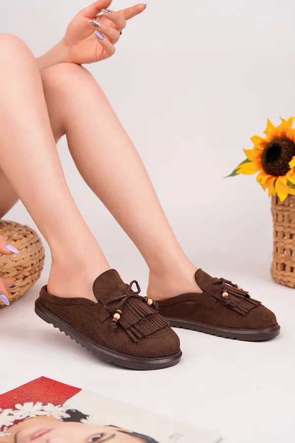 Mocassins Muggo FRINGE en daim, bout fermé, à pampilles et nœud décoratif.