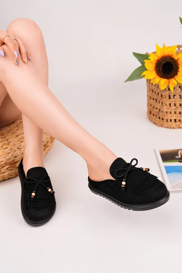 Mocassins Muggo FRINGE en daim, bout fermé, à pampilles et nœud décoratif.