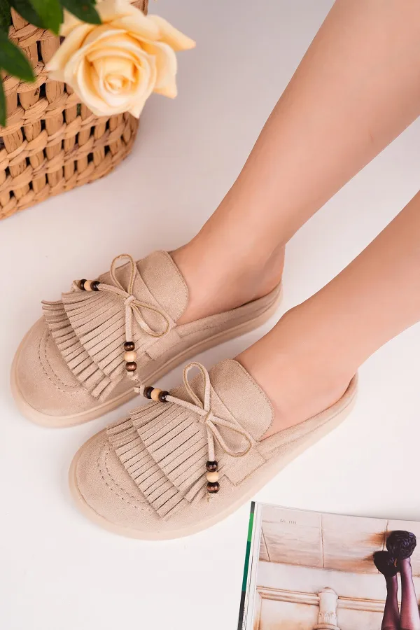 Mocassins Muggo FRINGE en daim, bout fermé, à pampilles et nœud décoratif.