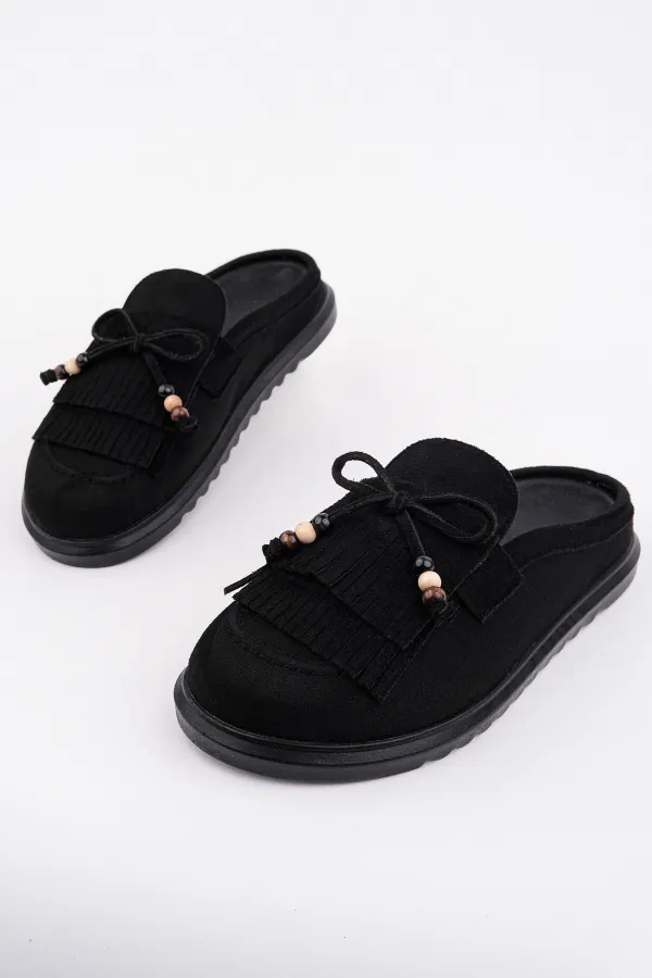 Mocassins Muggo FRINGE en daim, bout fermé, à pampilles et nœud décoratif.