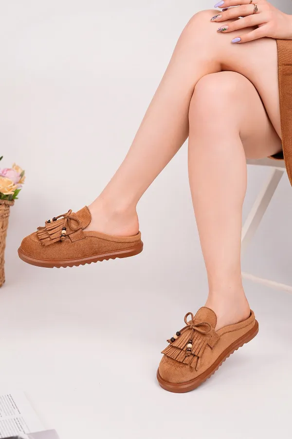 Mocassins Muggo FRINGE en daim, bout fermé, à pampilles et nœud décoratif.