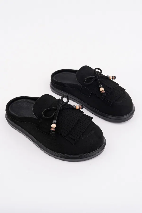 Mocassins Muggo FRINGE en cuir suédé pour femmes, bout fermé, ornés d'un nœud et de pompons, style confortable au quotidien.