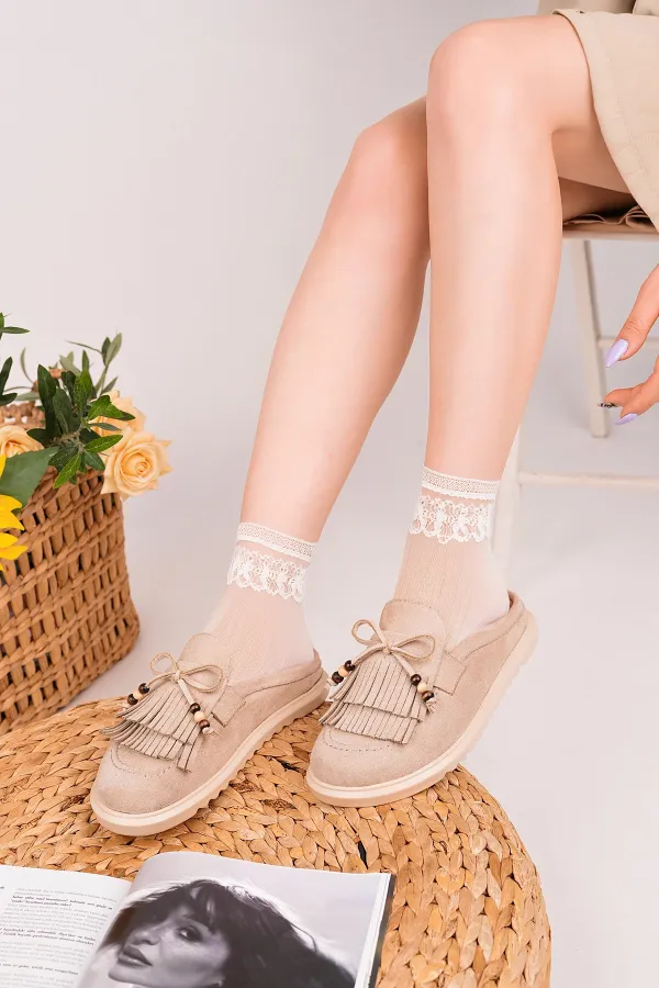 Mocassins Muggo FRINGE en daim, bout fermé, à pampilles et nœud décoratif.