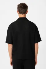T-shirt homme Antioch noir à col polo texturé et coupe décontractée
