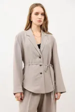 Veste cintrée drapée beige Antioch