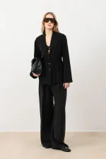 Veste cintrée noire drapée Antioch