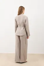 Veste cintrée drapée beige Antioch