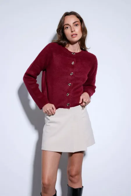 Jupe courte plissée en pierre d'Antioche avec détail de chaîne