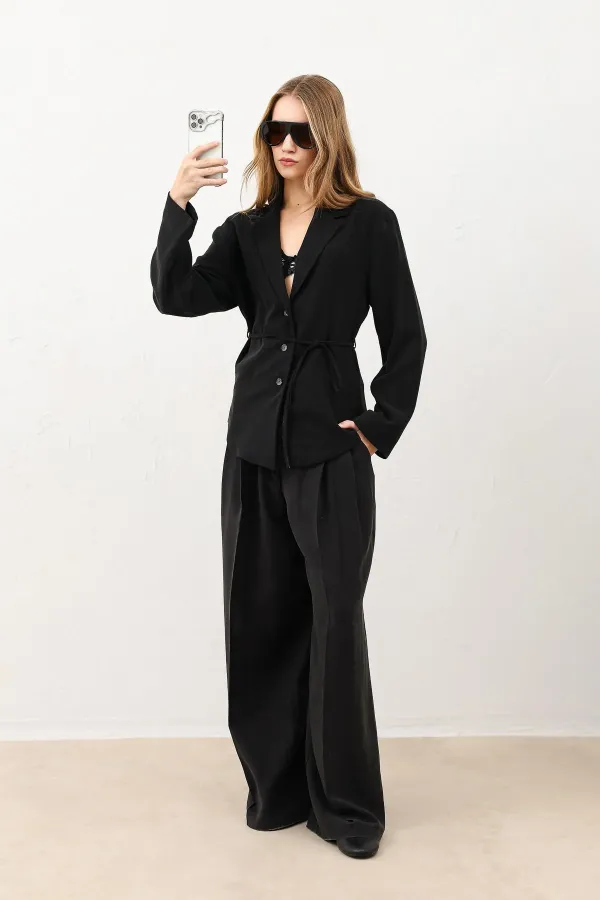 Veste cintrée noire drapée Antioch