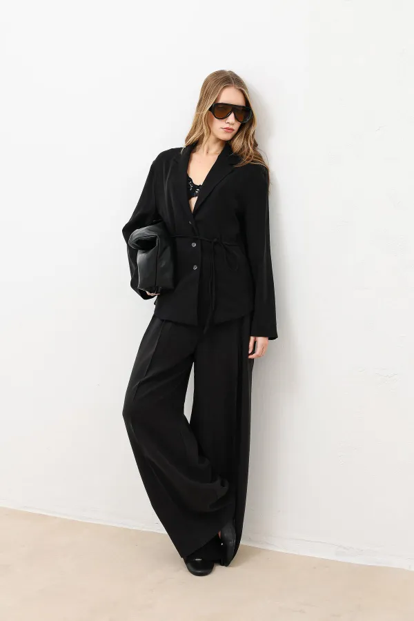 Veste cintrée noire drapée Antioch