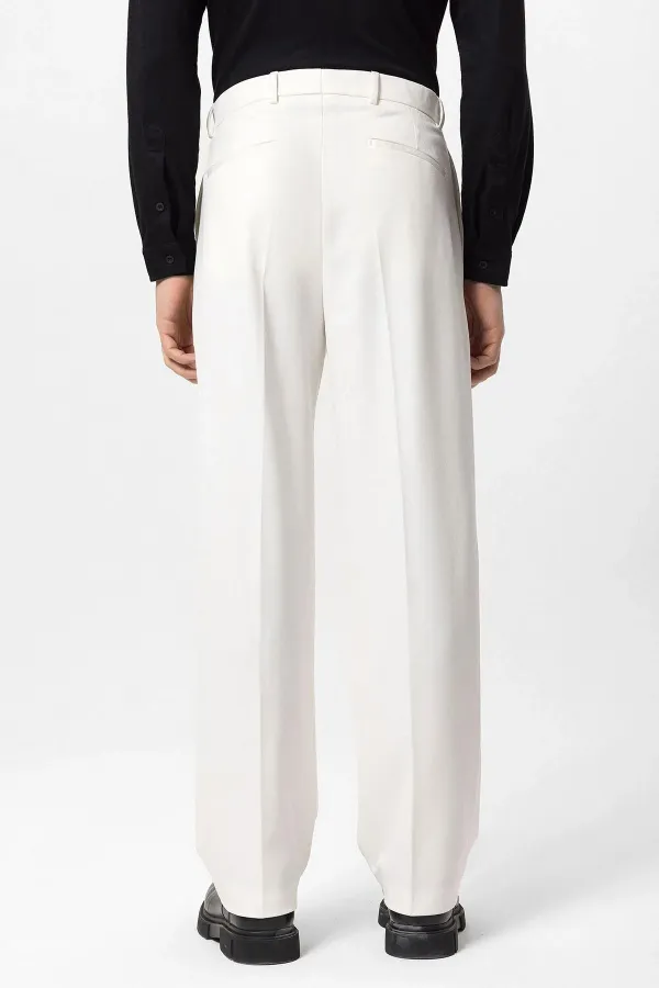 Pantalon Antioch écru à taille haute plissé et coupe décontractée pour homme