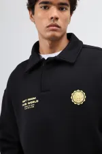 Sweat-shirt noir oversize à col polo imprimé délavé