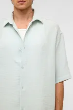 Chemise oversize à manches courtes en mousseline, bleue