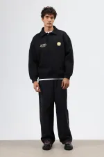 Sweat-shirt noir oversize à col polo imprimé délavé