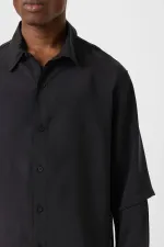 Chemise noire oversize à double manche