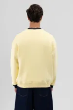 Sweat-shirt jaune oversize à col rond imprimé