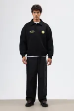 Sweat-shirt noir oversize à col polo imprimé délavé