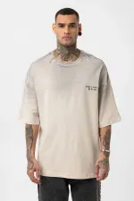 T-shirt oversize délavé avec détails textuels et ornements en pierre