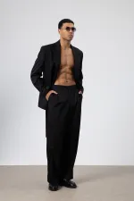 Costume noir oversize ceinturé