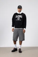 Sweat-shirt oversize noir imprimé bicolore