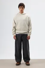 Sweat à capuche oversize beige avec détails brodés