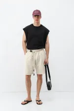 Short oversize en lin naturel avec ceinture