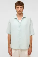 Chemise oversize à manches courtes en mousseline, bleue