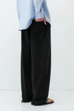 Pantalon ample en lin noir avec taille élastiquée