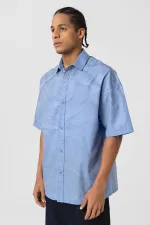 Chemise oversize en popeline délavée, bleue