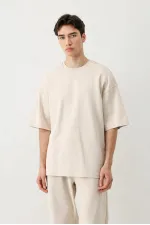 T-shirt oversize délavé à manches courtes couleur pierre.