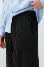 Pantalon ample en lin noir avec taille élastiquée