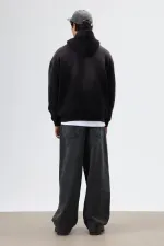 Sweat à capuche noir oversize imprimé et délavé