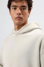 Sweat à capuche oversize beige avec détails brodés